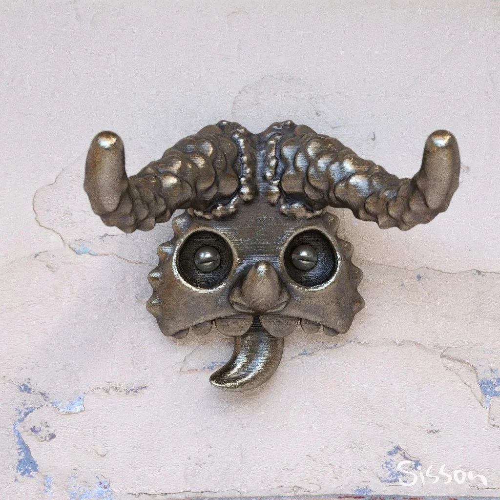 A compact horned face rendered with convincing metal and glass.