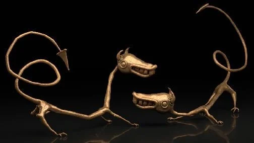 Brass study of two long, handmade-looking VR creatures rendered against black.