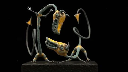 Surface study of two long, handmade-looking VR creatures rendered against black.
