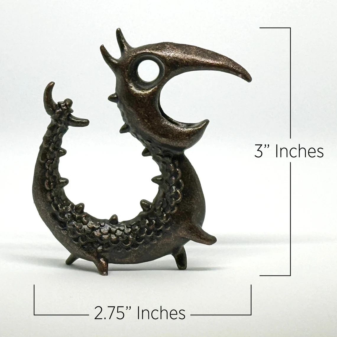 Dimensions of the Dragon Opener: 3 inches high and 2.75 inches wide.
